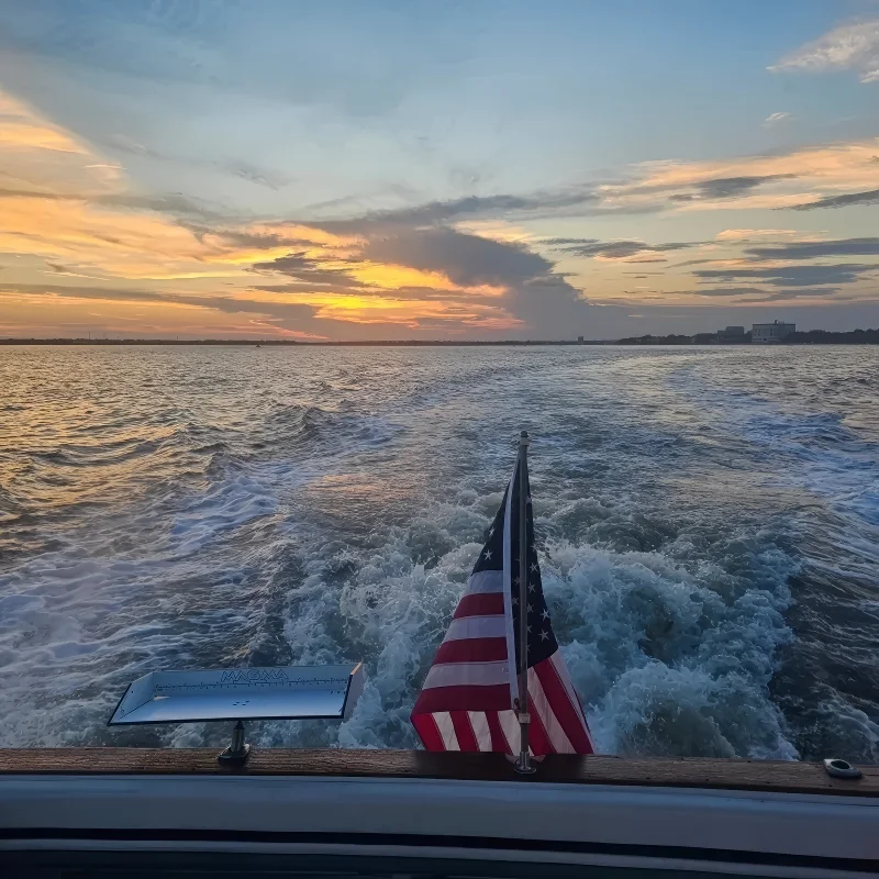 Couple celebrating aboard a private yacht at sunset in Charleston